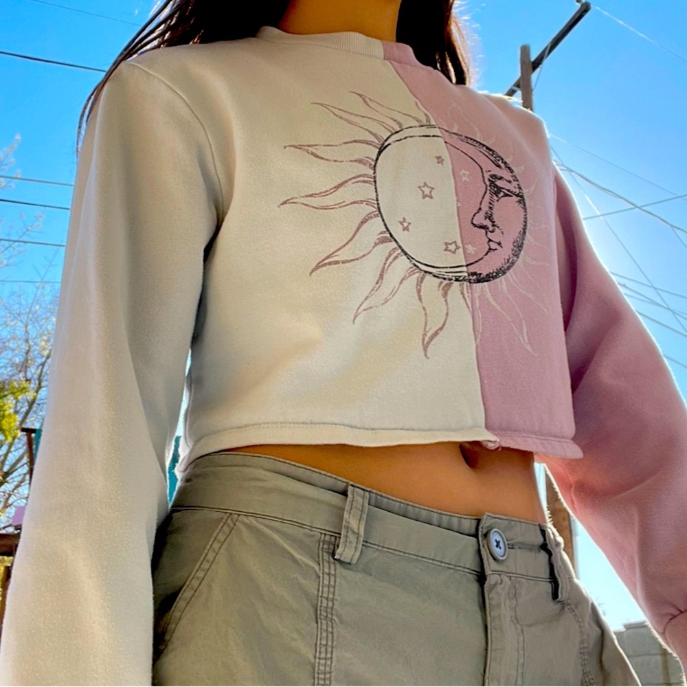 Purple and white long sleeve crop top.